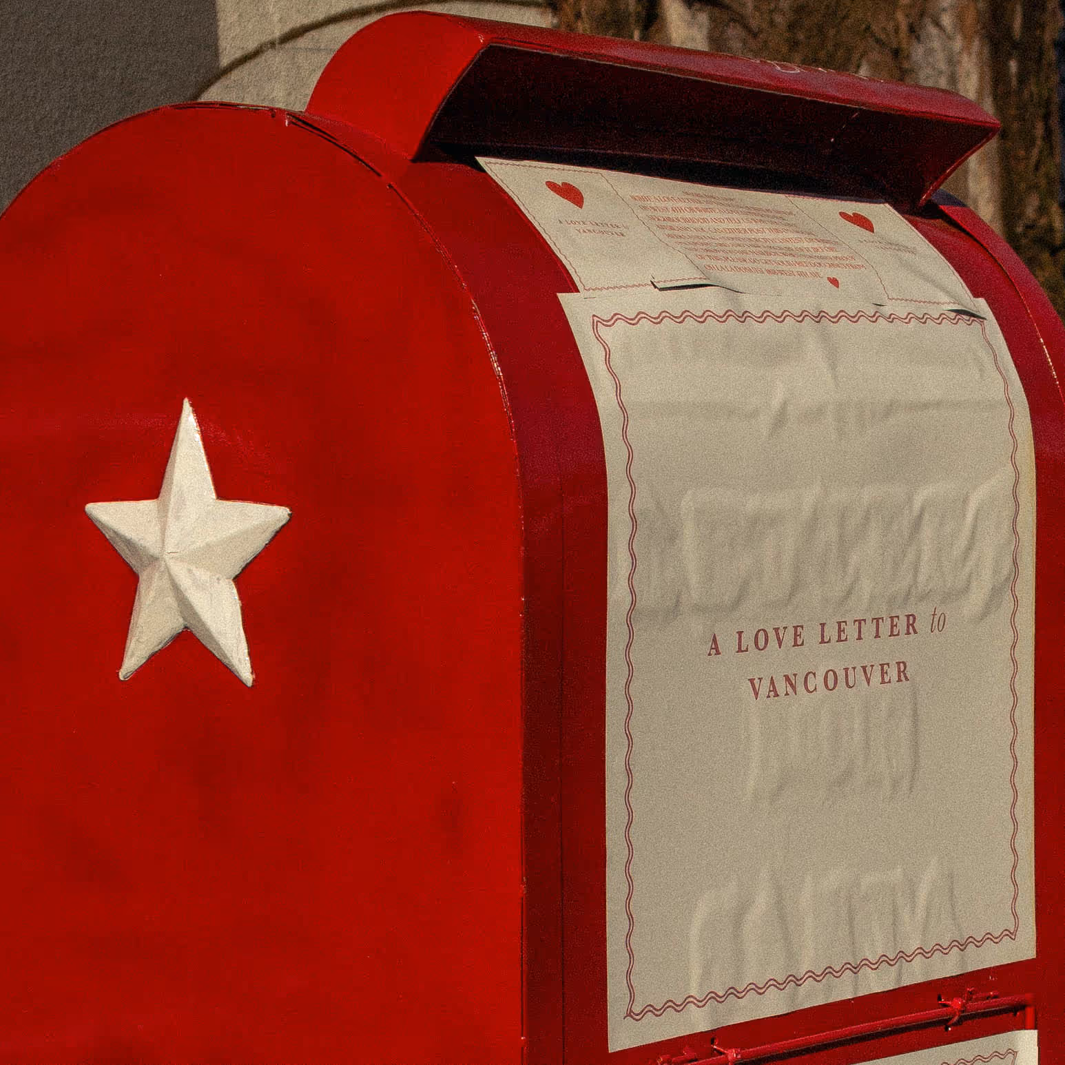 Close up a of a red mailbox, text says: A love letter to vancouver